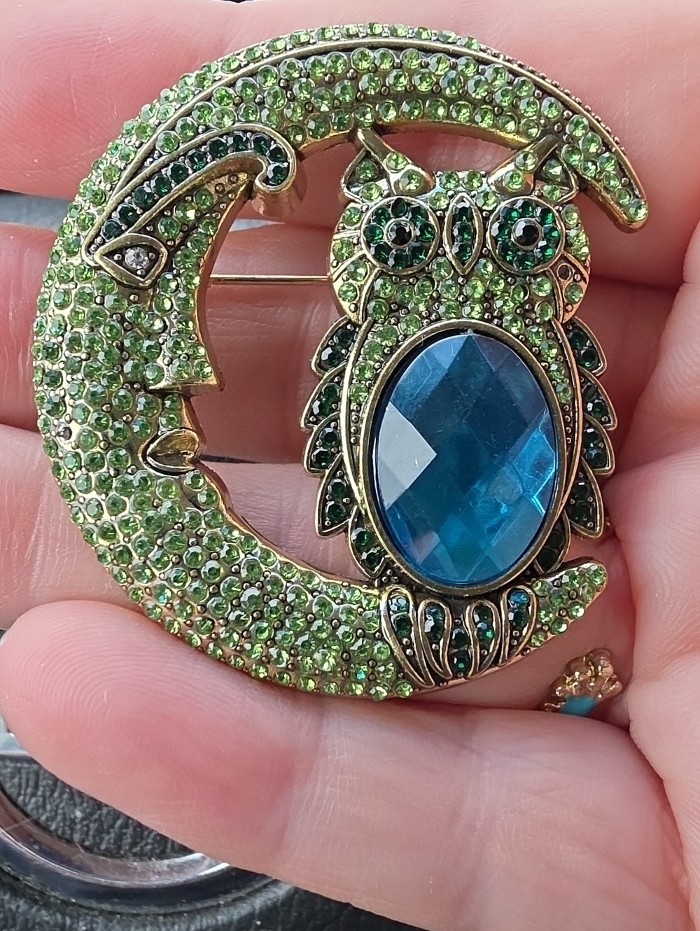 A68- Green Crystal Owl on Moon Brooch with Blue Center Stone